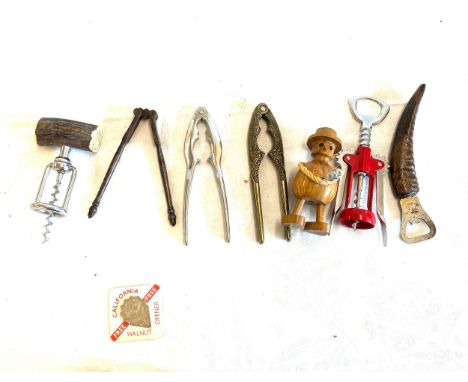 Selection of vintage and later nut crackers/ bottle openers 