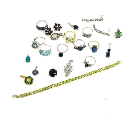 A good collection of vintage silver jewellery to include rings, earrings, bracelet, and pendants set with stones 