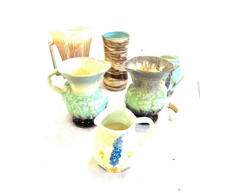 Six pieces of assorted pottery to include a pair of German jugs , a Radford piece  etc, Chips and a broken handle on jugs, 