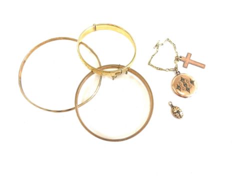 9ct gold bangle with metal core and 2 others including a gold coloured locket and cross