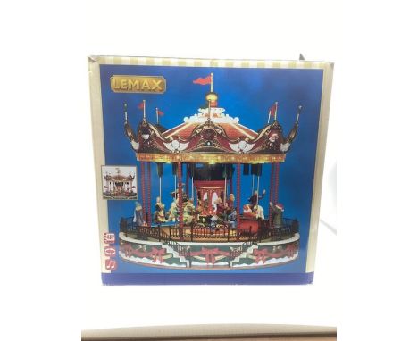 Lemax Christmas Village carousel fairground collection c 11’ tall all boxed with power plug( working at the point of testing)