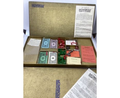 Rare 1936 Waddington Gold Edition monopoly in box in wonderful condition; includes the seldom seen rare metal tokens of troph