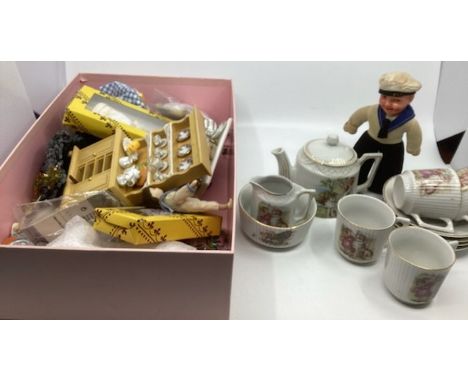 Childs toy 1920s China tea service with dolls and dog and various decals -( one cup has a hairline) together with a celluloid