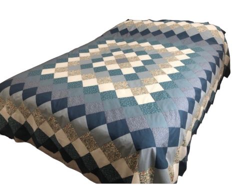 A tumbling block design cot quilt or wall hanging, hand sewn from Liberty fabrics, a pieced double bed sized quilt top, ready