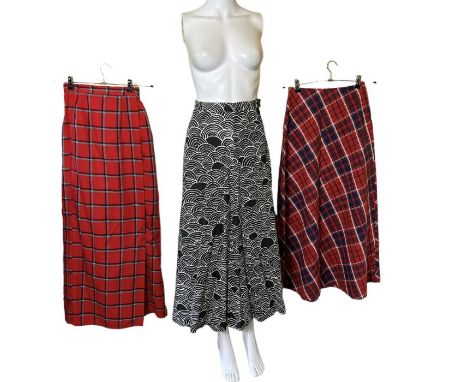 3 1970s maxi skirts. One labelled "Kati" with a monochrome deco print, one a tartan seersucker labelled "crazy horse" and ano