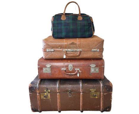 vintage luggage to include an early 20th century steamer trunk with stickers, two suitcases, one being in the style a small g