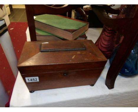 A Victorian mahogany tea caddy