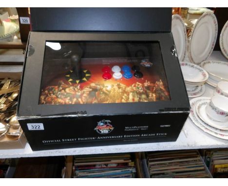 A boxed Street fighter 15th anniversary edition arcade stick
