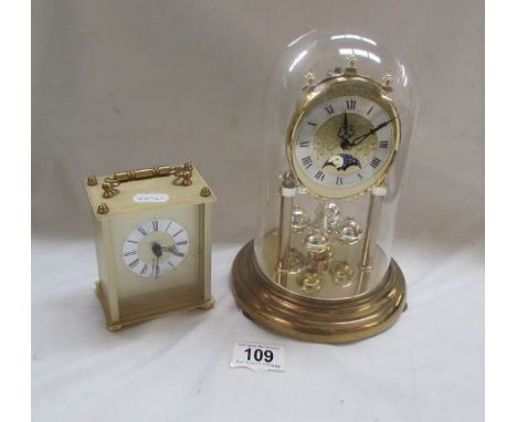 A clock under dome and a modern quartz carriage clock