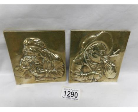 A pair of 19th century brass portrait plaques
