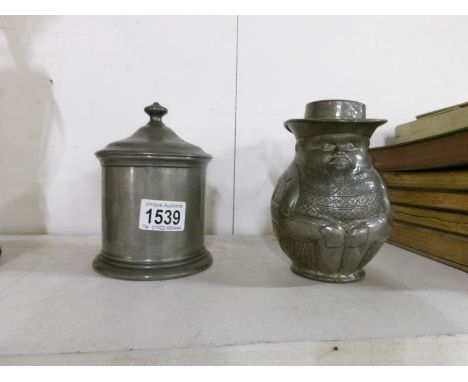 A James Dixon pewter tea caddy / tobacco jar and a John Turton pewter lidded character jug