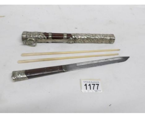 An antique rosewood and silver knife in scabbard with ivory chopsticks