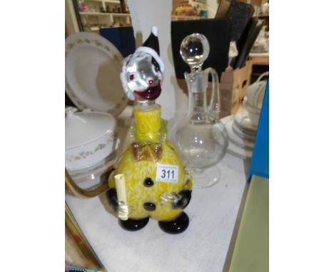 A glass clown and a glass decanter
