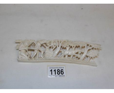 An anitque carved ivory of a hunting scene signed Emson Mujuru