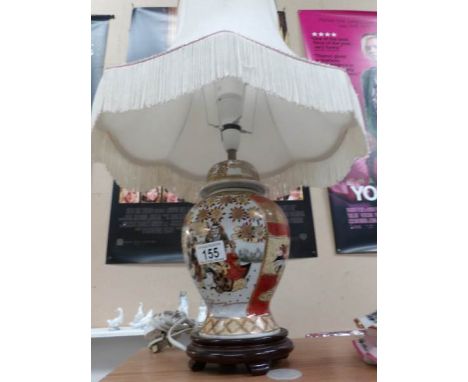 An oriental style table lamp with shade