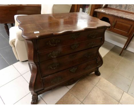 A 19th century oak bombe commode