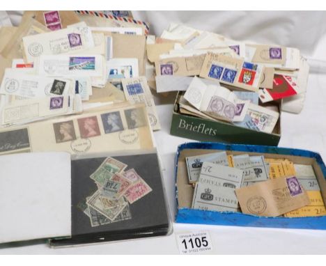 A tin of UK stamps including First day covers, Victorian penny reds and high value