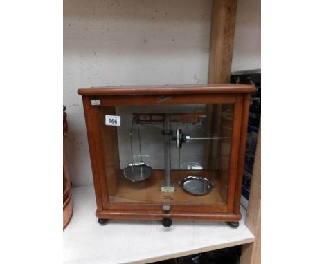 A cased set of apothecary scales