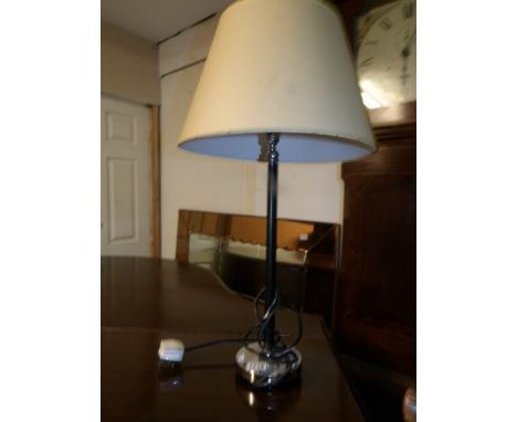 A chromed table lamp