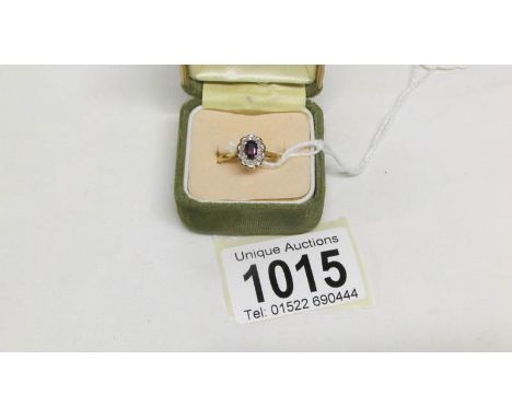 An 18ct gold ring set diamond cluster, size V