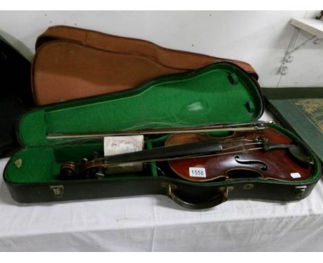 A cased Viola with bow and label that reads Stradivarius