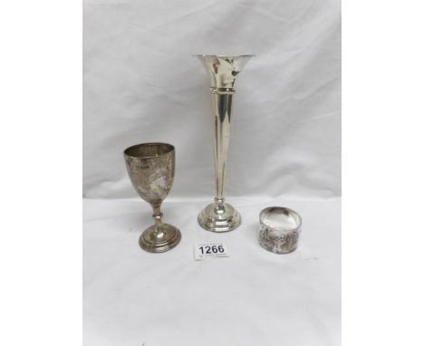 A silver spill vase, silver goblet and silver napkin ring