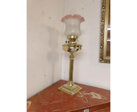 A brass table oil lamp