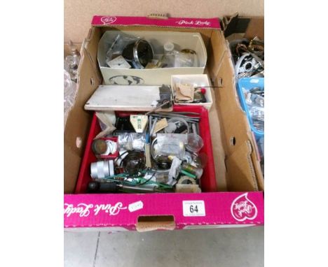 A box of watch and clock parts together with tools