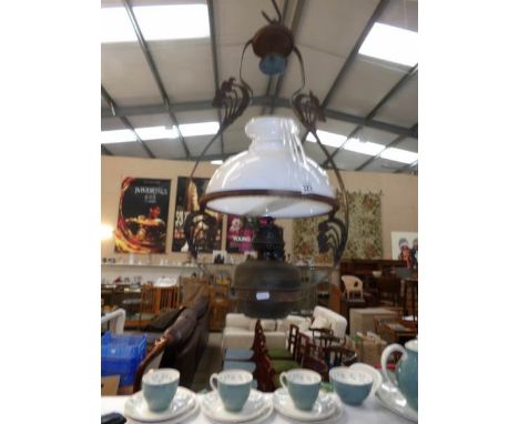 An oil ceiling lamp including frame, burner, shade and smoke deflector