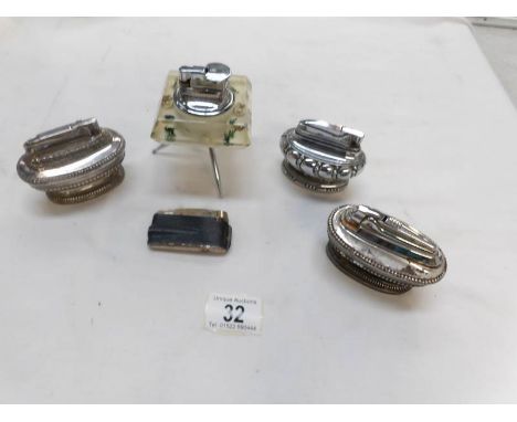 A Lucite 'Sputnik' lighter and 4 others