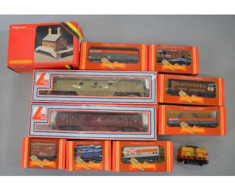 OO Gauge. 2 x Lima diesel hydraulic locomotives together with 8 x Hornby rolling stock & boxed R. 511 waiting room. 