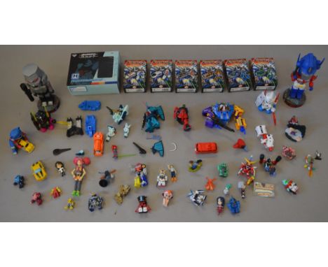 Quantity of assorted Transformers and Gundam figures: two Kid Robot DamGun figures; three Ichibankuji Gundam Series figures;s