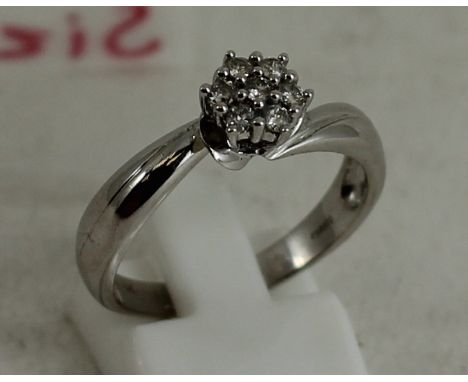 18ct white gold solitaire ring with 7 small diamonds approx 0.04ct each. Size R. Total weight: 4.8g 