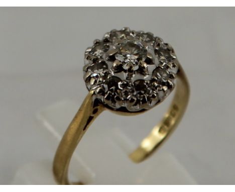 Ladies Diamond cluster ring - 8  small diamonds and 1 larger centre diamond approx. 0.2ct. Size: L/M