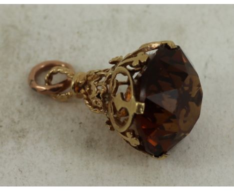 9ct yellow gold watch fob with burnt orange stone. Total weight: 7.7g 