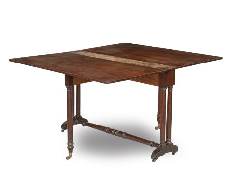 A late Victorian mahogany and ebonised line inlaid Sutherland tableThe hinged top above turned supports united by a turned st