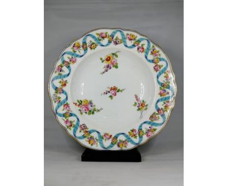 A 19th century set of 10 gilt floral earthenware soup platesEnamel decorated with floral sprays within a blue ribbon and garl