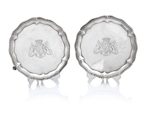 A pair of George III waitersby John Carter, London 1769Of shaped circular form  with gadroned rim, on three claw and ball fee