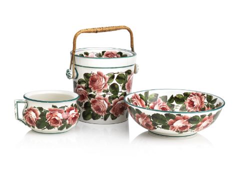 A wemyss part toilet setComprising a water pail, basin and chamber pot, all decorated with cabbage roses, impressed crescent 
