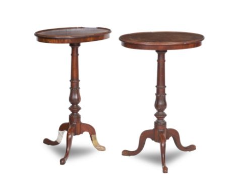 A pair of early 19th century mahogany tripod tablesThe oval tops on turned supports and tripod bases, one pad foot detached, 