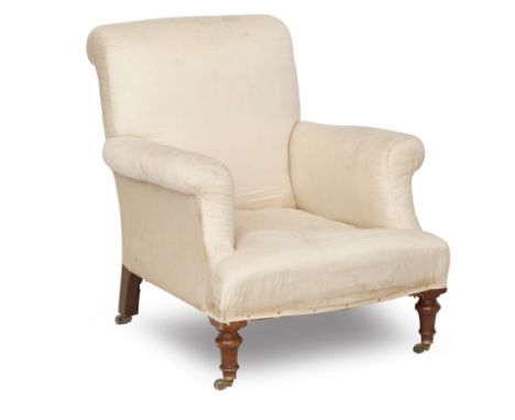 A first half 20th century upholstered easy armchairOn turned beech front legs and brass castors, 75cm wide x 85cm deep x 87cm