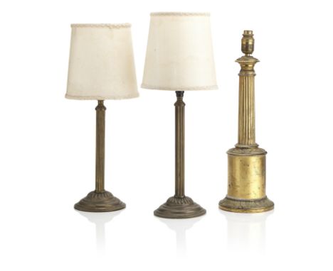 A Victorian gilt brass table lampWith acanthus moulded foot and reeded column, converted from an oil lamp, together with two 