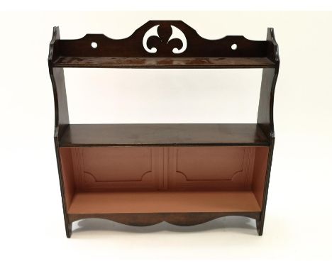 A 19th century mahogany three tier hanging wall shelf with painted back, 60cm high x 58cm wide x 15cm deep