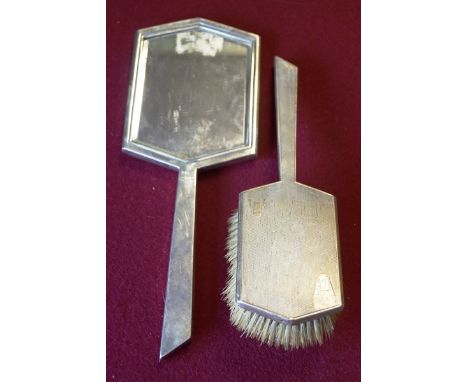 An Art Deco silver part dressing table set of shaped hexagonal form, highlighted with engine turned engraving, comprising a h