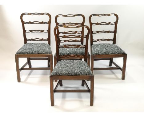 A set of six mahogany dining chairs with pierced ladder backs, drop in seats on square tapering legs