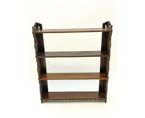 A 19th century mahogany four tier wall shelf with pierced sides, 76cm high x 63cm wide x 14cm deep