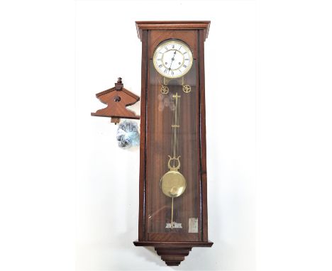  A Franz Hermle eight day chain driven regulator in mahogany case, with enamel dial, 110cm high