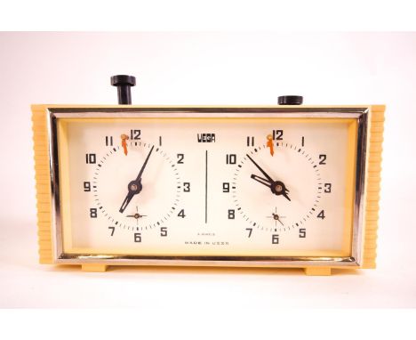 A mid 20th century cream coloured cased Russian manual wind four jewel movement Chess clock by Vega, 11cm high x 21cm wide