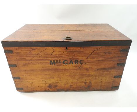 A 19th century iron bound pine trunk/chest of rectangular form, the top set with a large brass ring oull handle and the front