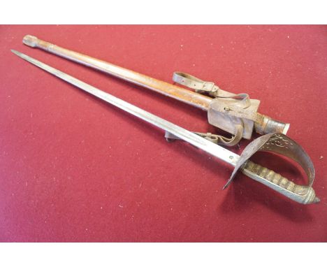 A George V officers sword, the blade inscribed "Lieut Colin B Callander by the Ilminster Town and Grammar School......", in l